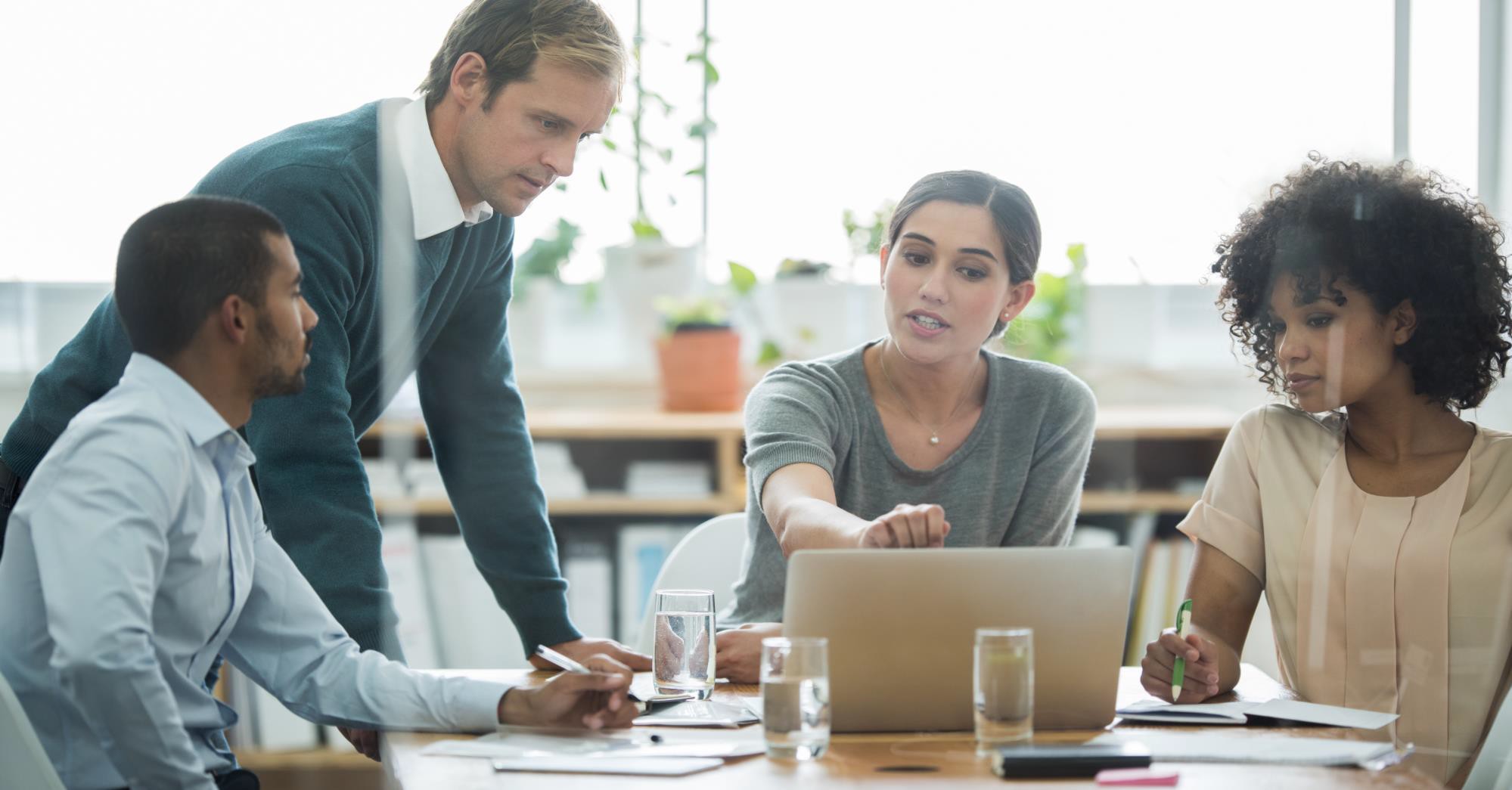 Advisors collaborating around a conference table